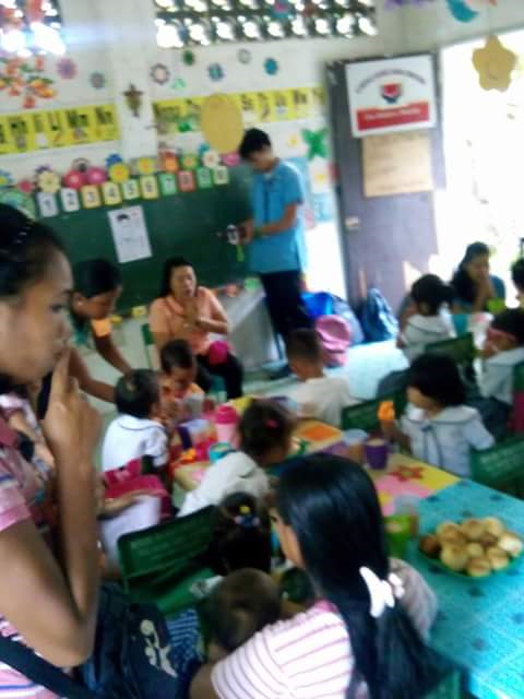 Teaching and giving milk and bread in the class rooms